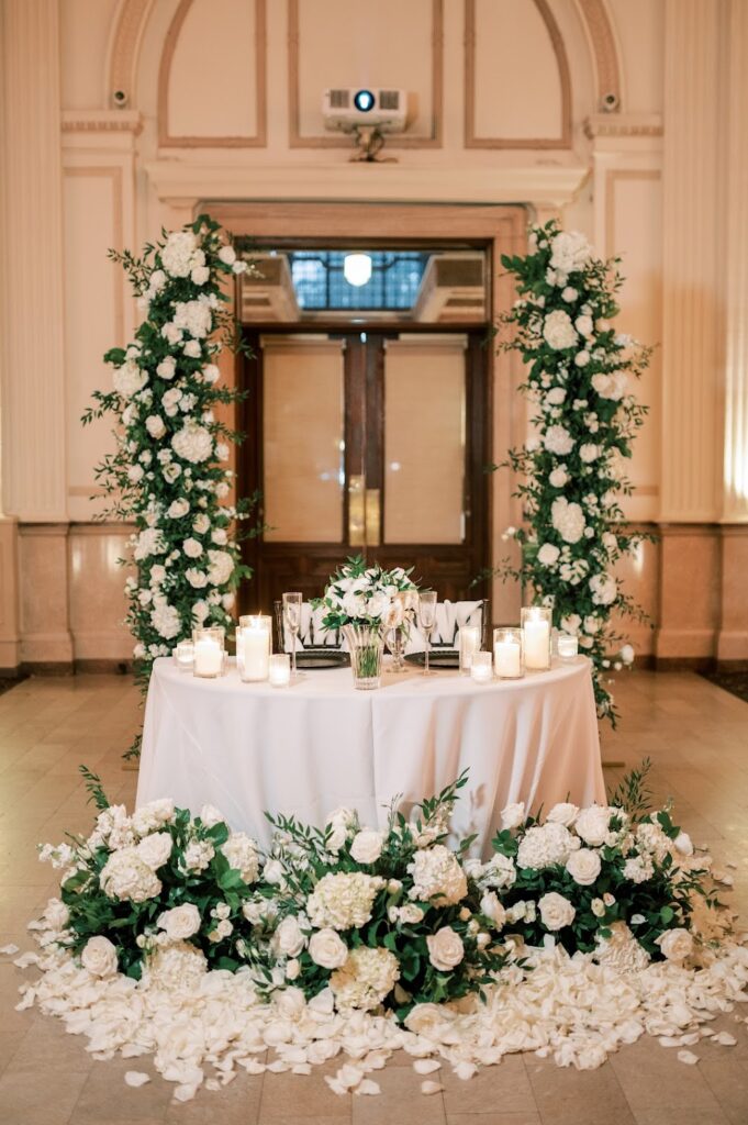 Ceremony arbor installation repurposed behind the sweetheart table