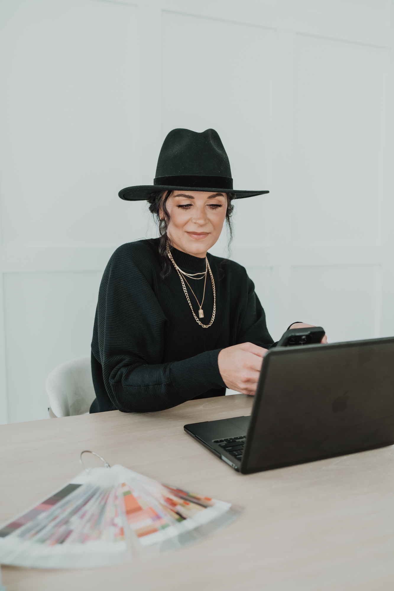 Wedding florist business owner getting ready for a meeting with her computer